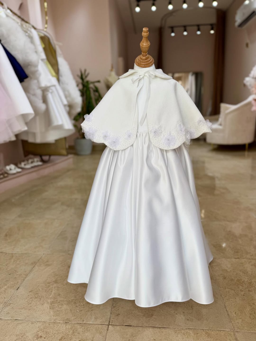A Beautiful Handcrafted Cape Adorned with Delicate Crystals and Flora