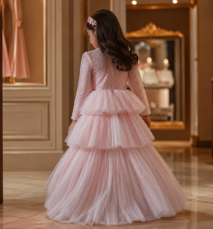 Delicate and elegant baby dress crafted in soft blush pink tones